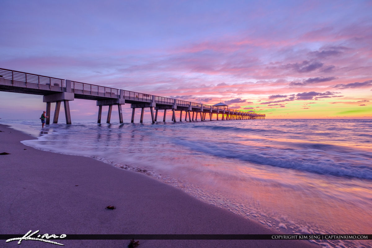 Juno Beach Pier Along the Beach During Sunrise Royal Stock Photo
