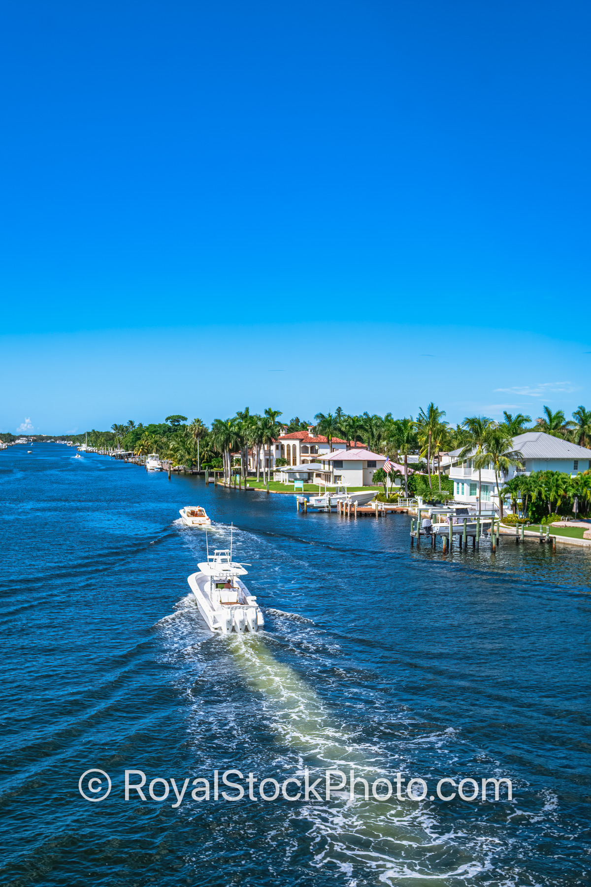 Boats at Waterway and Residential Homes