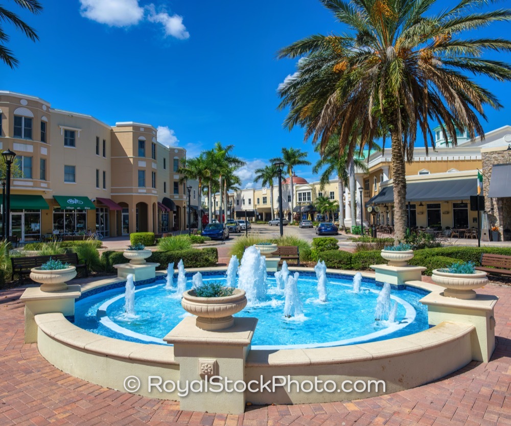 Decorative Fountain Surrounded by Palm Trees and MediterraneanStyle ...