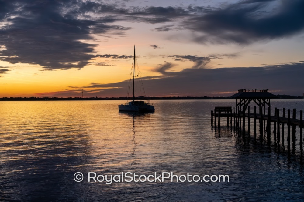 Authentic Coastal Lifestyle Showcases Boat Docked at Indian River Lagoon During Sunset in Melbourne Beach on River Road 20260102